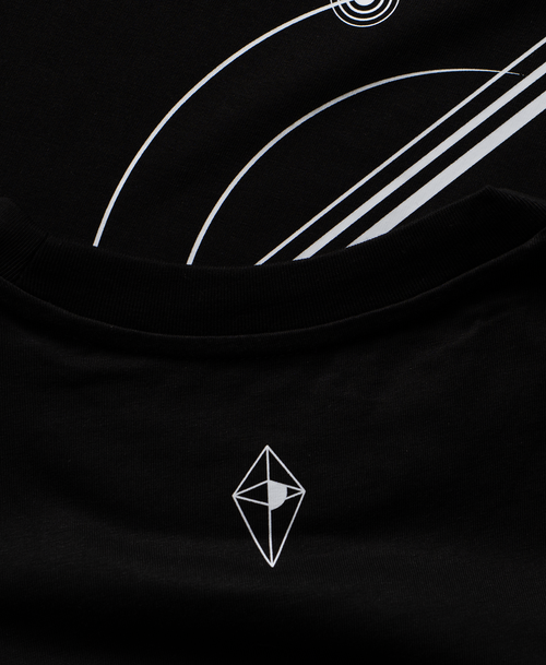 Close-up of a black t-shirt featuring a white No Mans Sky logo.